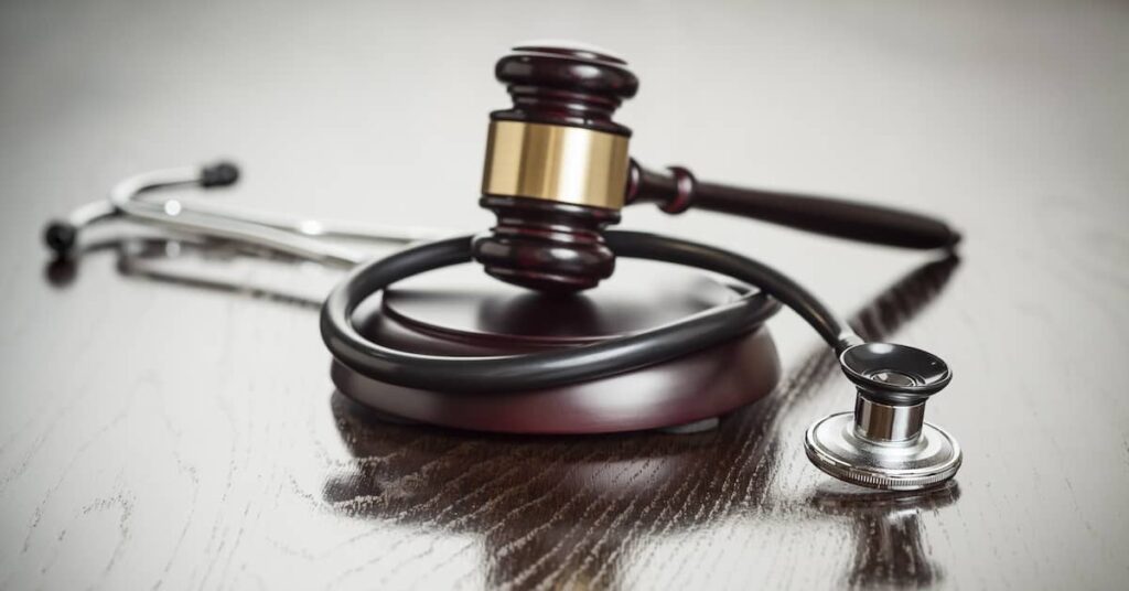 Gavel and stethoscope symbolizing medical malpractice law | Burg Simpson