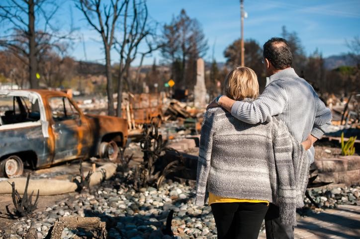 Couple looking at destroyed property