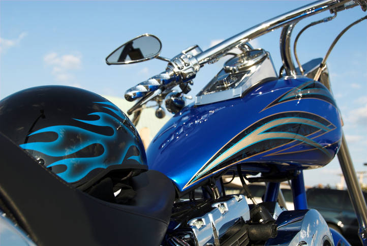 Motor cycle with a helmet on the seat