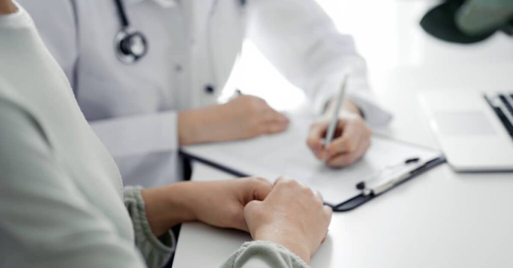 Woman obtaining from her doctor medical records in a personal injury claim | Burg Simpson