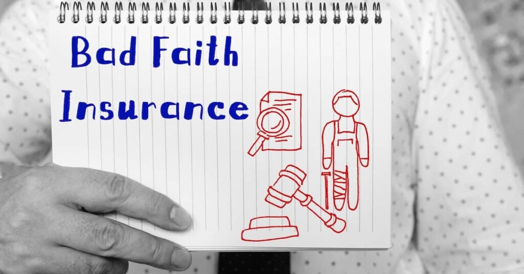Lawyer holding a notebook that reads 'Bad Faith Insurance' with related drawings | Burg Simpson