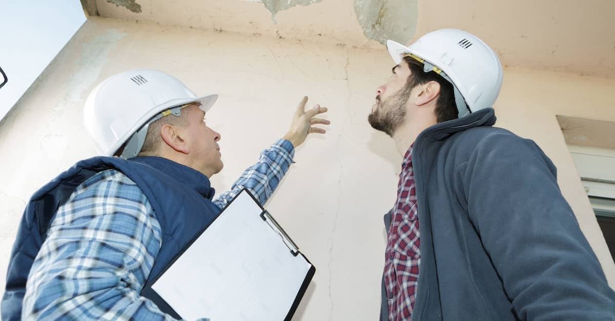 Home inspectors examining construction defects | Burg Simpson Law Firm