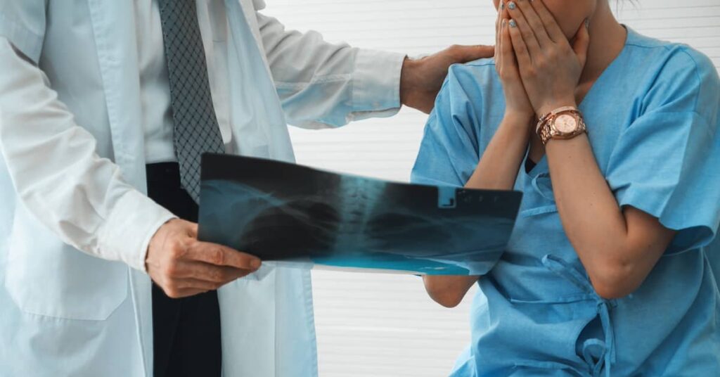 Doctor revealing medical malpractice/misdiagnosis to patient | Burg Simpson Law Firm