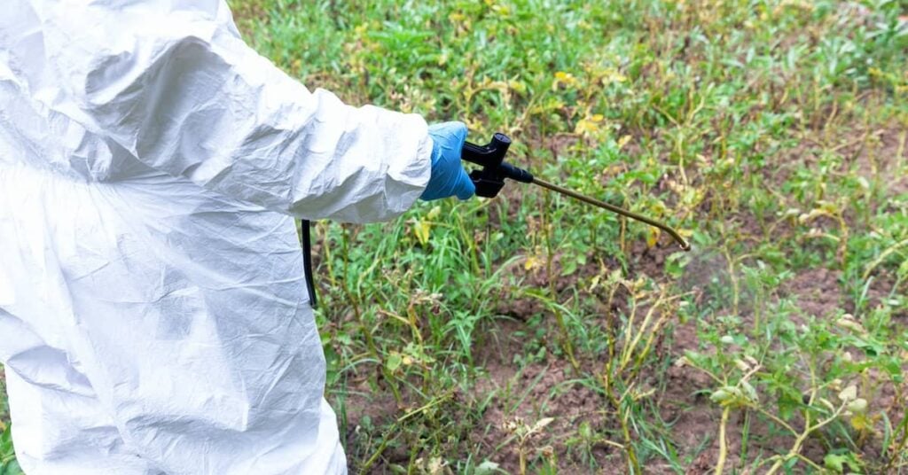 Worker spraying Roundup (glyphosate) herbicide | Burg Simpson Law Firm