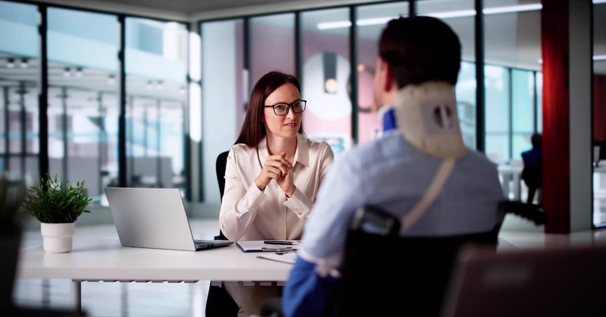 Injured client meeting with a lawyer about a personal injury claim | Burg Simpson