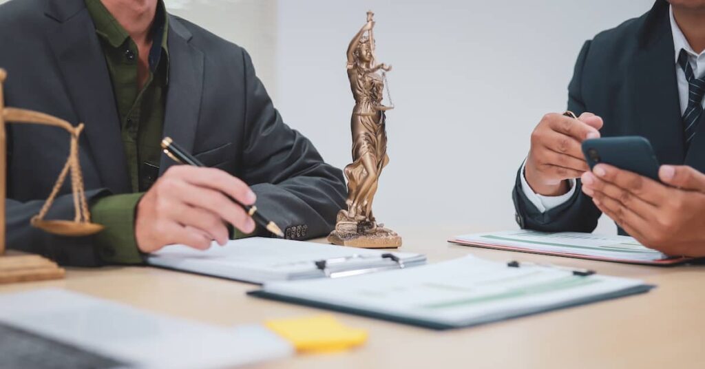 Lawyers negotiating personal injury settlement | Burg Simpson