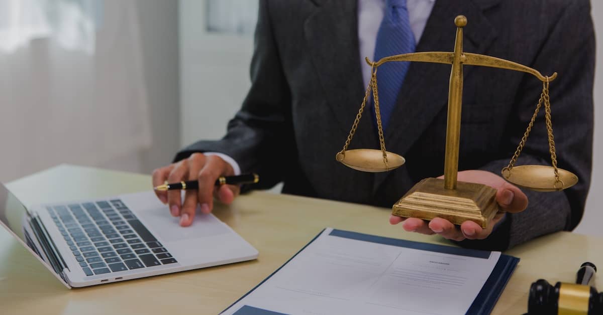 Personal injury attorney working at his desk | Burg Simpson