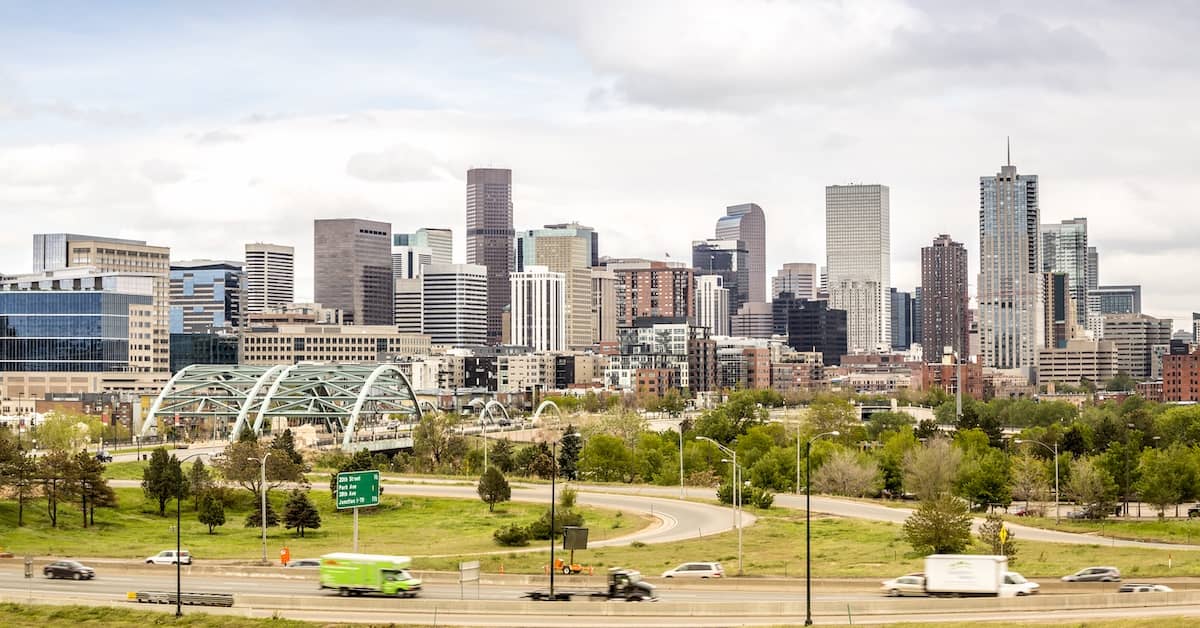 Cars and trucks on a road outside Denver, Colorado | Burg Simpson