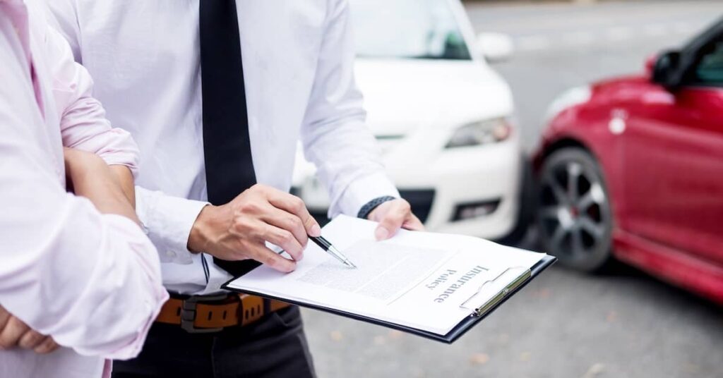 Insurance adjuster reviewing Ohio car accident settlement offer | Burg Simpson