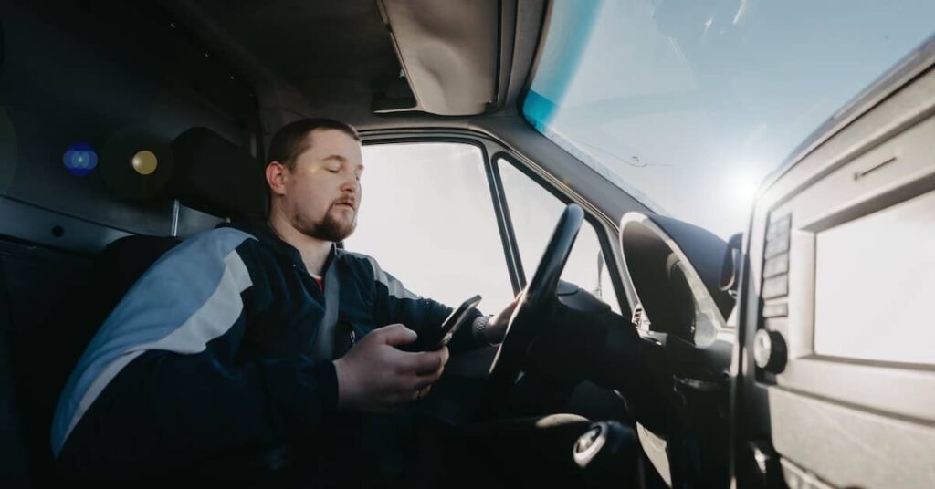 Distracted truck driver texting while driving | Burg Simpson