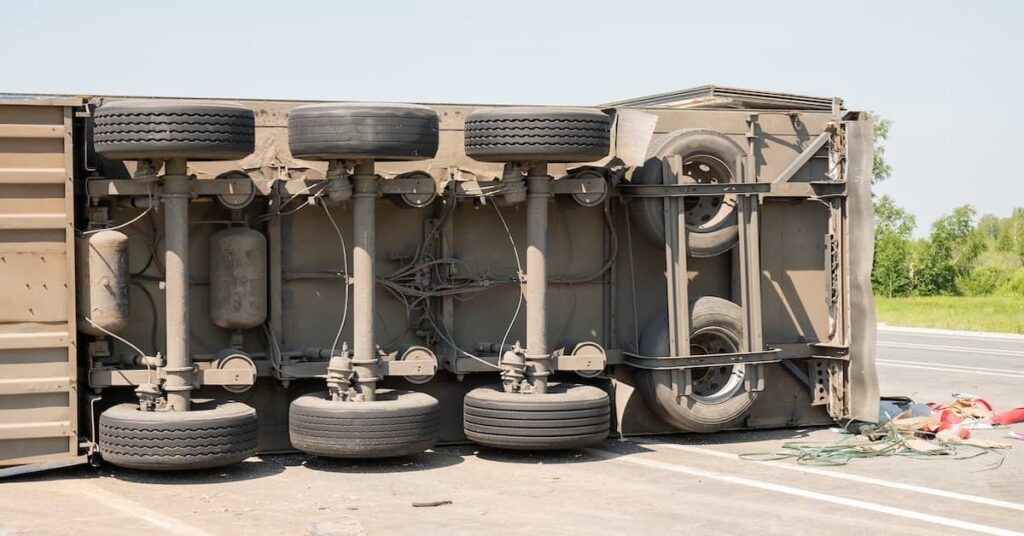 Semi-truck roller over on its side | Burg Simpson