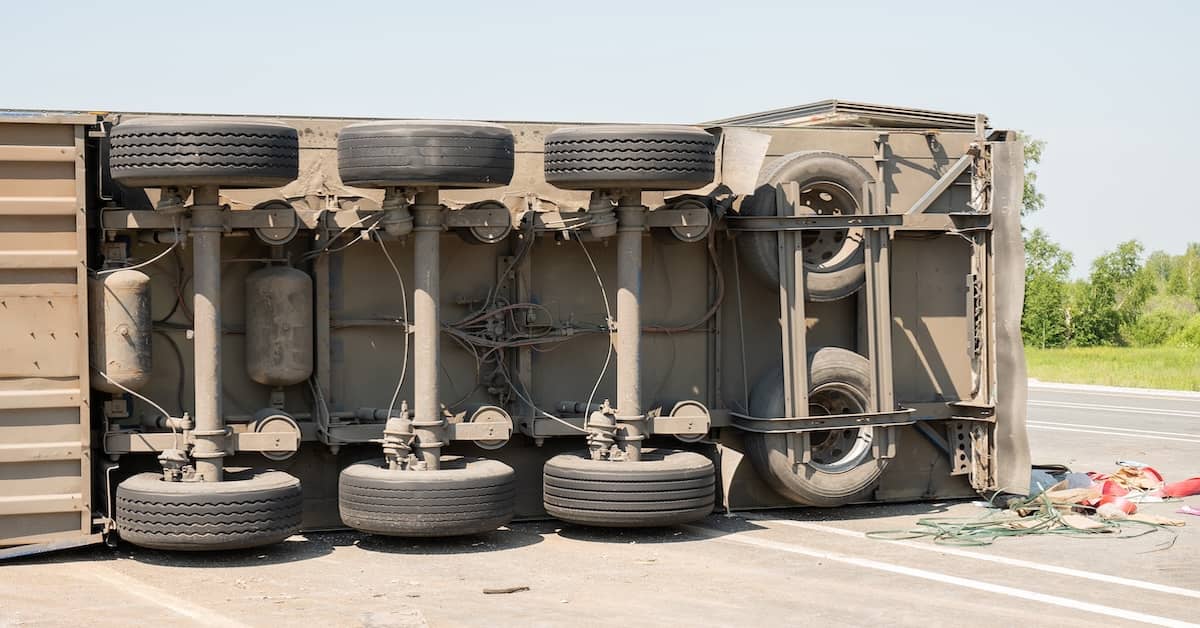 Semi-truck roller over on its side | Burg Simpson