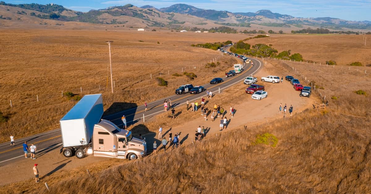 Jackknifed truck holding up traffic on mountain road | Burg Simpson