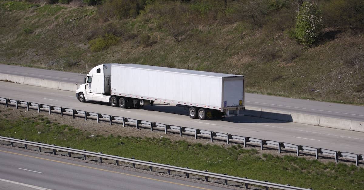 18-wheeler truck on a mountain highway | Burg Simpson