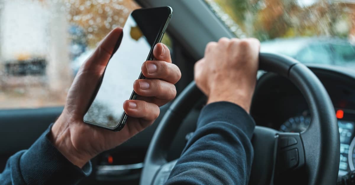 Motorist violating the Colorado hands-free law by using a cell phone behind the wheel | Burg Simpson
