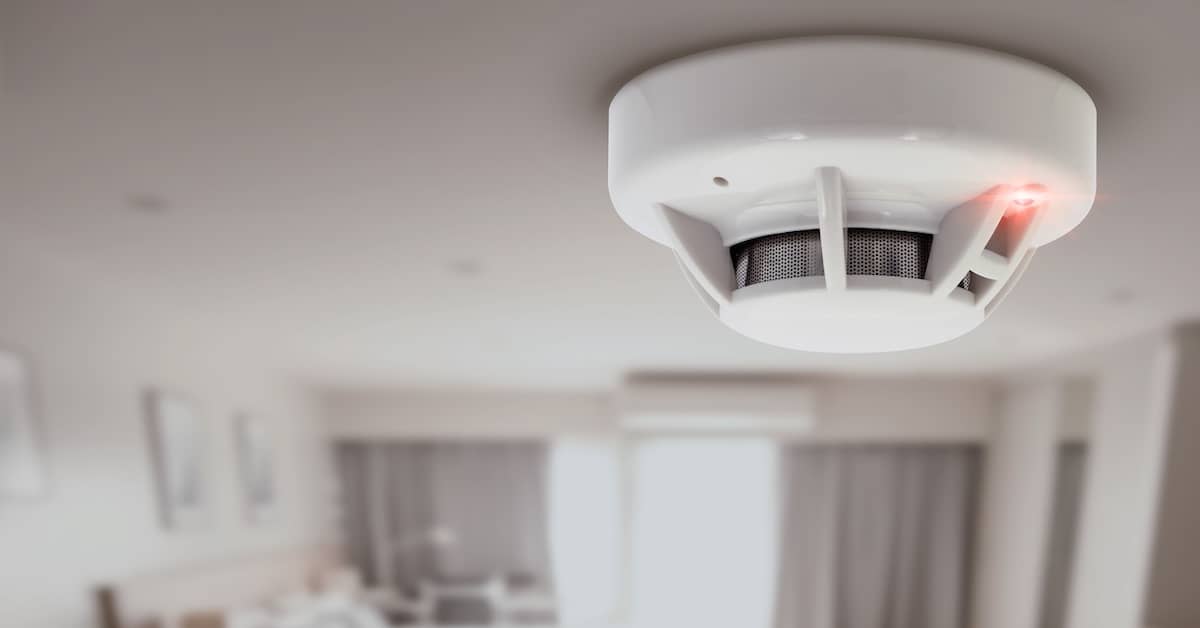 Carbon monoxide detector on the ceiling of a hotel room | Burg Simpson