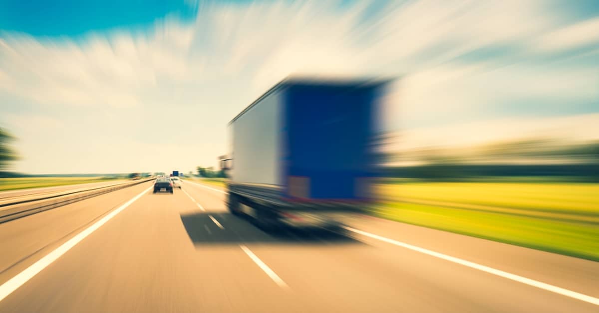 Speeding semi-truck on a two-lane road | Burg Simpson