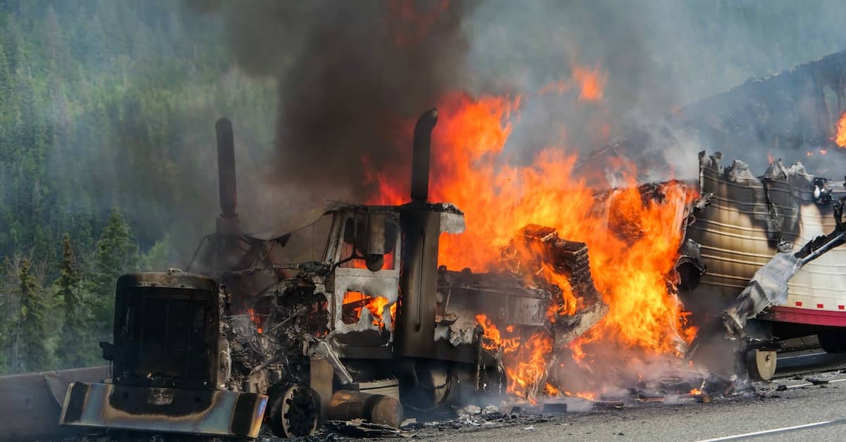 Semi-truck engulfed in flames after a truck accident | Burg Simpson